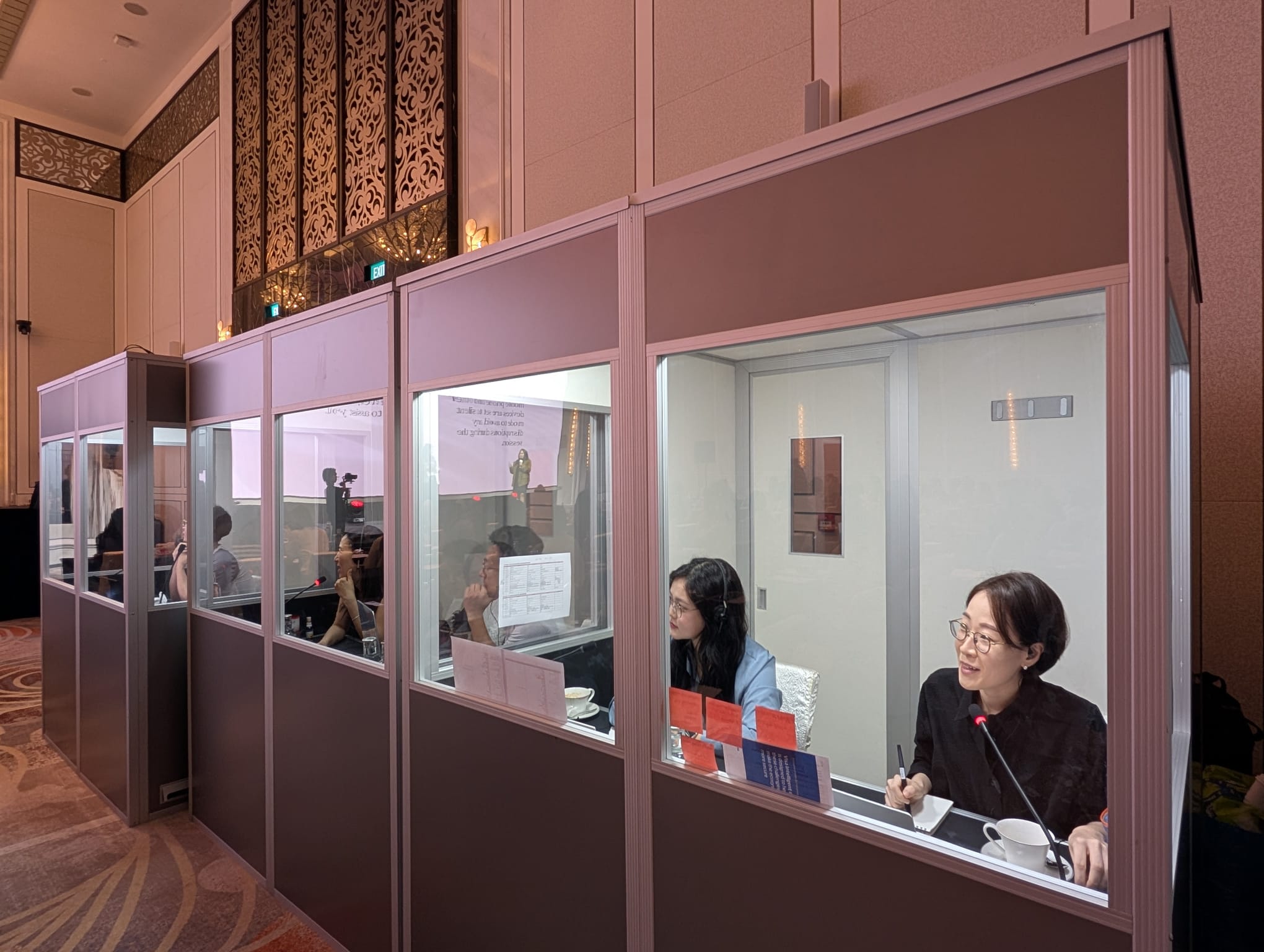 SI booth with interpreters working